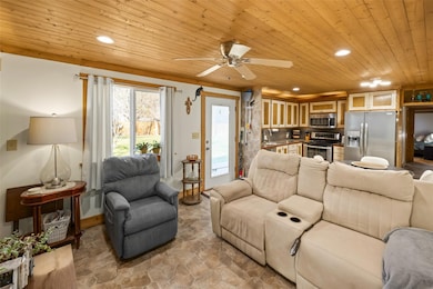 Living room featuring recessed lighting, wood cei