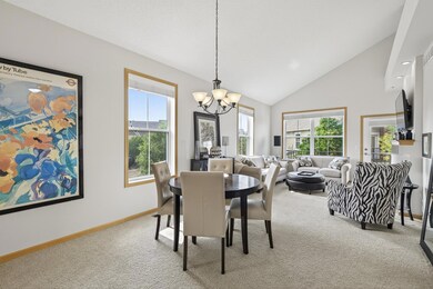 Flooded with natural light, vaulted ceilings and custom wood blinds throughout