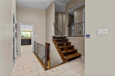 Stairs lead to bedroom level and family room level