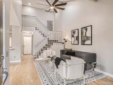 Living Room with wood floors, vaulted ceiling, fireplace, 2 skylights