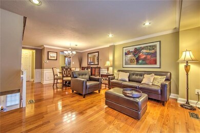Living room/dining room combination boasts beautif
