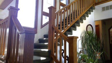 Tile flooring and floor to ceiling windows the len