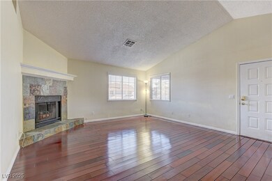 Unfurnished living room with a fireplace with rais