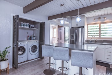 Full size washer and dryer neatly tucked away.