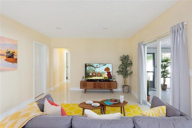 Family room with sliders to back screen porch