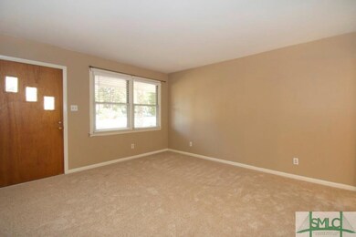 OPEN LIVING ROOM WITH PLENTY OF LIGHT