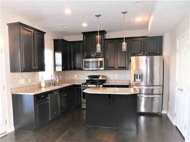The professionally painted gourmet kitchen with ce
