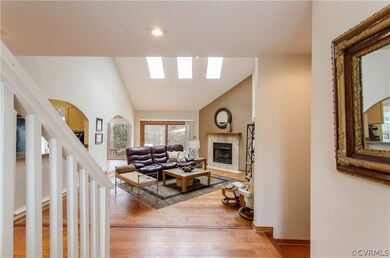 Welcoming foyer with a glass front door and sideli