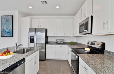 Kitchen with appliances with stainless steel finis