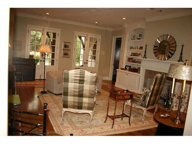 wide plank hardwood, built in bookcases, marble fi