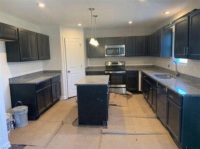 Large kitchen with slate-colored cabinets