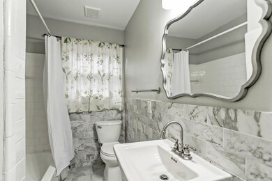 Remodeled bath conveniently located in the hall be