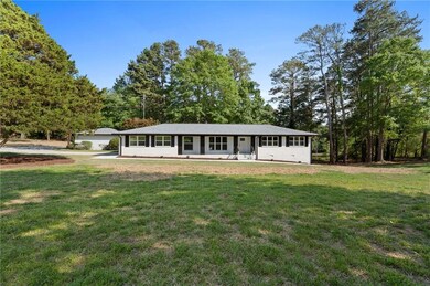 Single story home with a front yard