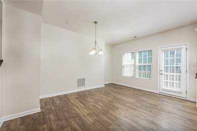 The dining room area with a little nook to the back that could be a wine or coffee bar space.
