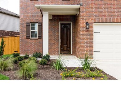 Doorway to property featuring brick siding and an