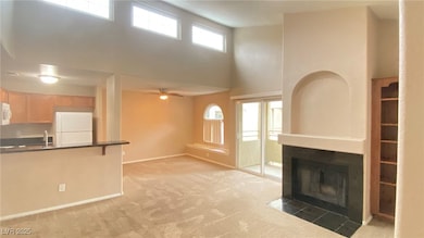 Unfurnished living room featuring a towering ceili