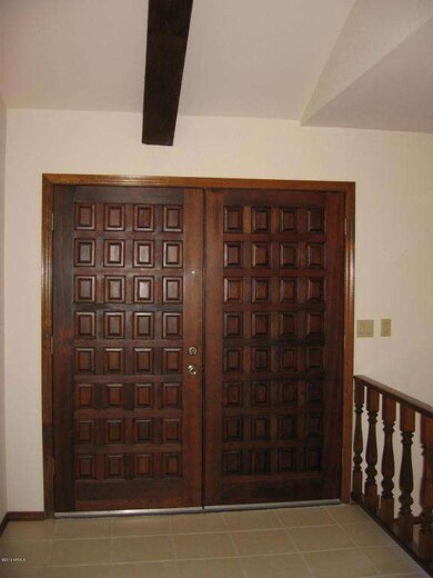 Double-Doors Open Into Foyer