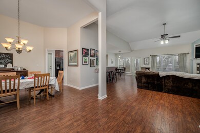 Open concept living at its best!  Formal dining leads to the large den complete with fireplace.