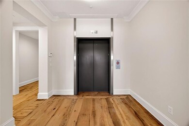 Step off your private elevator into timeless elegance - warm hardwood floors and sleek finishes set the tone for luxury living.