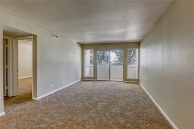 Entryway looking toward living room and balcony