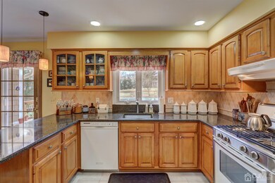 Eat-in Kitchen has plenty of maple cabinets and qu