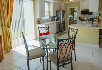 Dining room featuring light tile patterned floorin