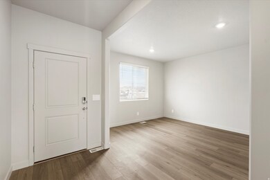Foyer entrance featuring light wood-style flooring and recessed lighting