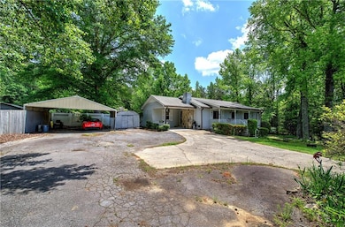 View of front facade featuring covered porch, driv