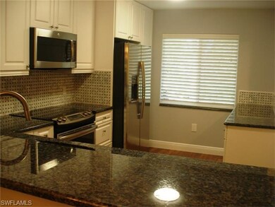 A sleek brand new GE stainless side by side frig i