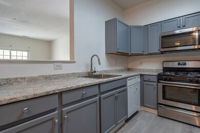 Spicket Commons unit 115, Methuen, MA 01844 - photo 6