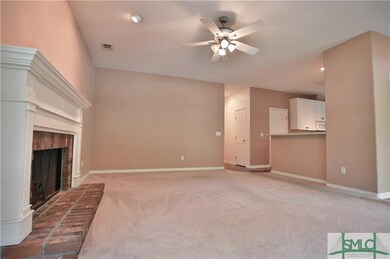 Living Room with Brick Fireplace.