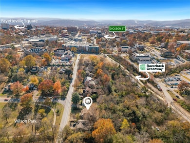 Aerial overview of property's location featuring a mountain backdrop