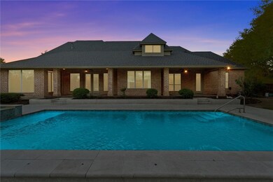 Pool at dusk with a patio