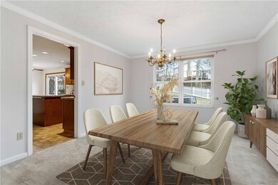 Dining room that opens to the kitchen and living r