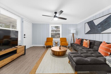 Living room with hardwood / wood-style floors, cro