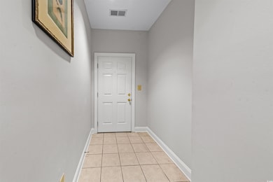 Doorway to outside with light tile patterned floor