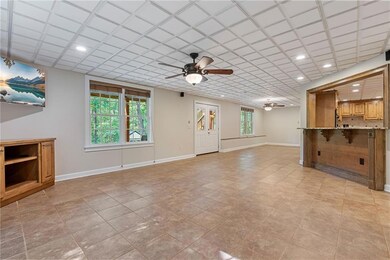 Terrace level also has a second laundry room, bedroom, full bathroom, and storage.