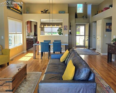 Living area looking into the dining and kitchen spaces
