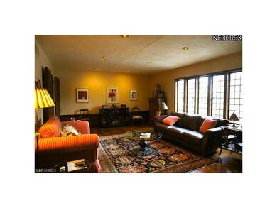 Large Living room with oak floors,  wainscoating a