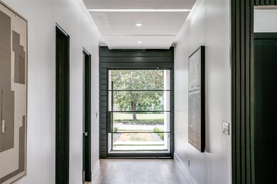 Doorway with wood-type flooring and plenty of natu