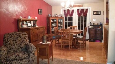 Wood flooring and French doors.