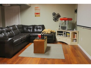 Lower level basement is finished except for the ceiling.  Media room has laminate 