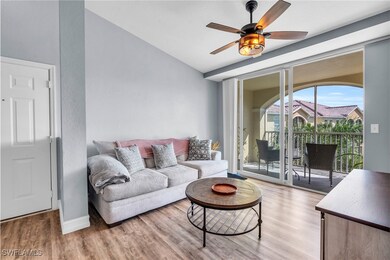 Living room with light hardwood / wood-style floor