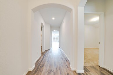 Hallway featuring wood-type flooring