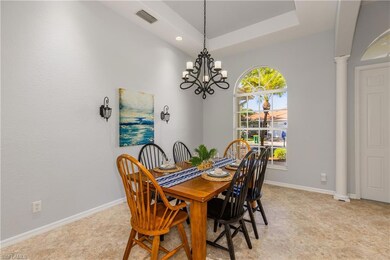 Dining space with tray ceiling and space for the w