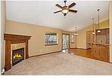 Living Room Has Gas Fireplace And Extends to Dinni
