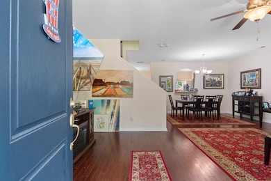 Foyer entrance featuring ceiling fan with notable 