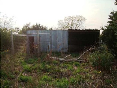Metal horse corral, pole barn