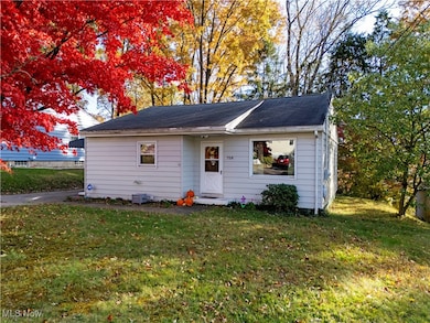 Bungalow-style home featuring a front lawn
