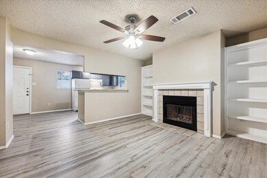 Unfurnished living room featuring a textured ceil